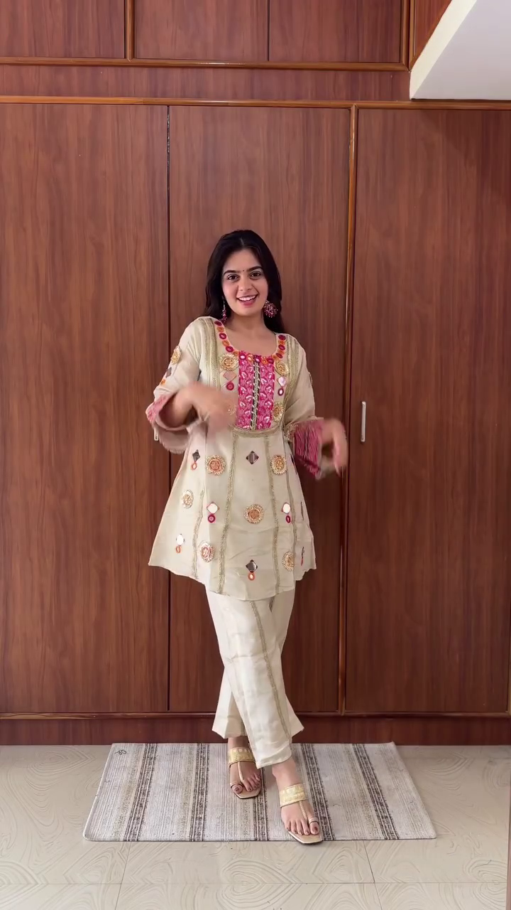 Traditional Ivory Silk Straight Kurta Set with Pink-Gold Mirror Embroidery, Gota Work, and Festive Mirror Appliqué Accents Paired with Coordinated Palazzo Pants - Image 4