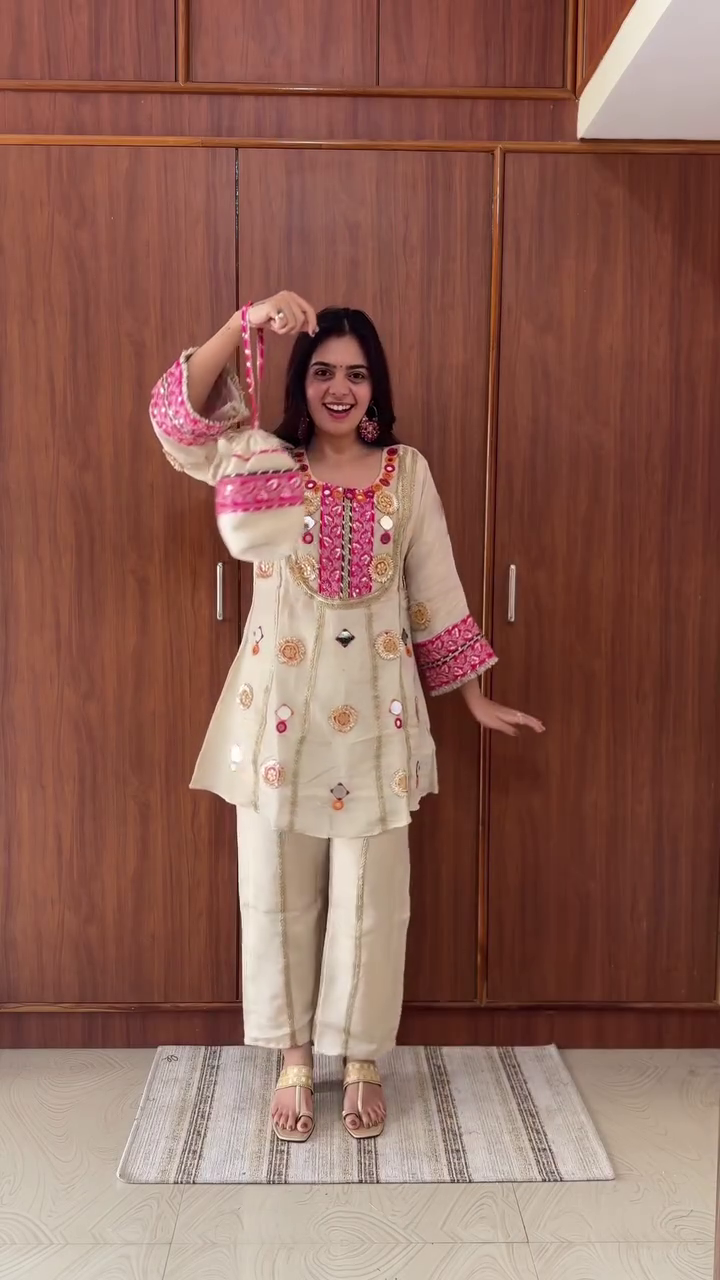 Traditional Ivory Silk Straight Kurta Set with Pink-Gold Mirror Embroidery, Gota Work, and Festive Mirror Appliqué Accents Paired with Coordinated Palazzo Pants - Image 3