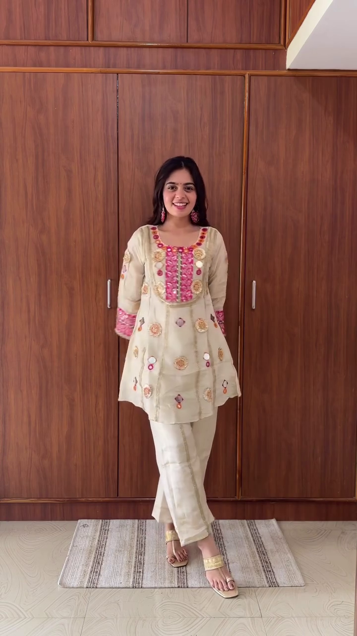 Traditional Ivory Silk Straight Kurta Set with Pink-Gold Mirror Embroidery, Gota Work, and Festive Mirror Appliqué Accents Paired with Coordinated Palazzo Pants - Image 2