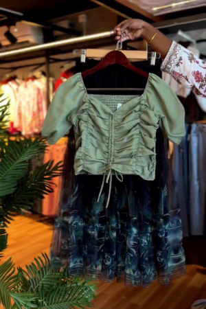 Chic & Trendy: Green Ruched Crop Top with Black Patterned Skirt ππ€